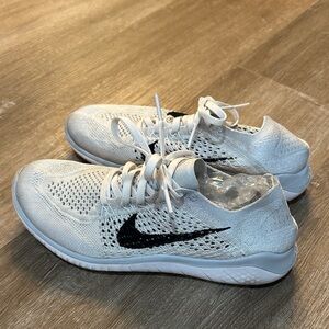 Nike White Knit Sneakers with Black Swoosh